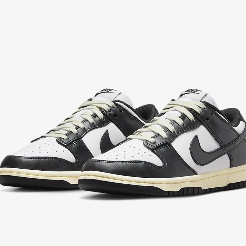 Nike low dunk rpm black and white with cream detail.